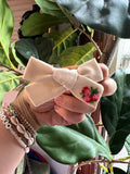 Flower embroidered bow on clip